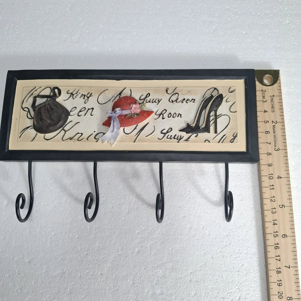 Wall Hook Rack with Black Frame and Red Hat Accent